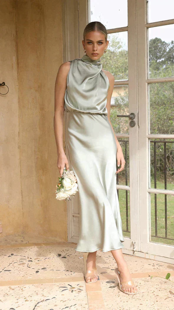 Flattering women's halter midi dress, ideal for wedding guests, formal events, or party wear with a chic look.
