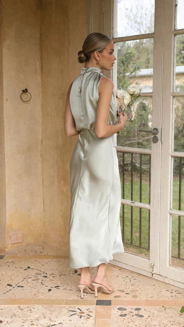 Women's elegant midi dress with a stylish halter neckline and flowing silhouette, versatile for any special event.