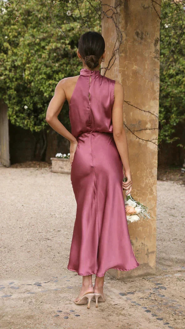 Chic women's summer halter midi dress with a flowing, flattering design, perfect for elegant daytime or evening wear.