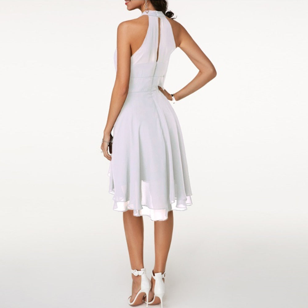 Chic black halter mini dress for women, featuring a beautiful fluid drape. Ideal for evening events.