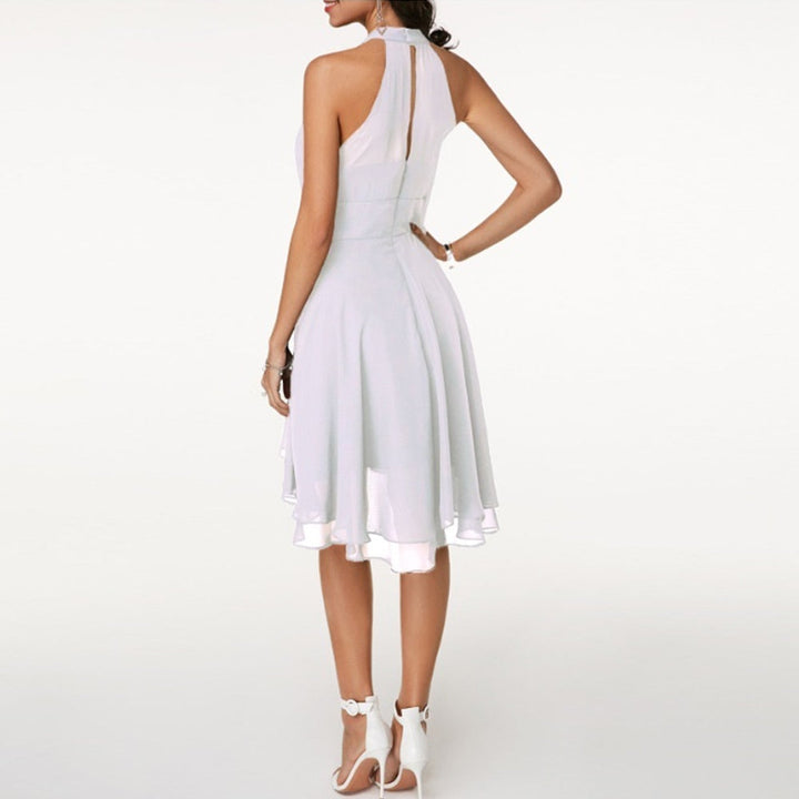 Chic black halter mini dress for women, featuring a beautiful fluid drape. Ideal for evening events.