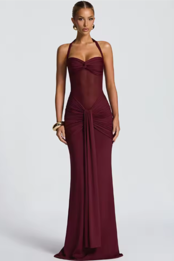 Women's formal ruched bodycon maxi dress featuring a chic halter neck and knot front for special occasions.