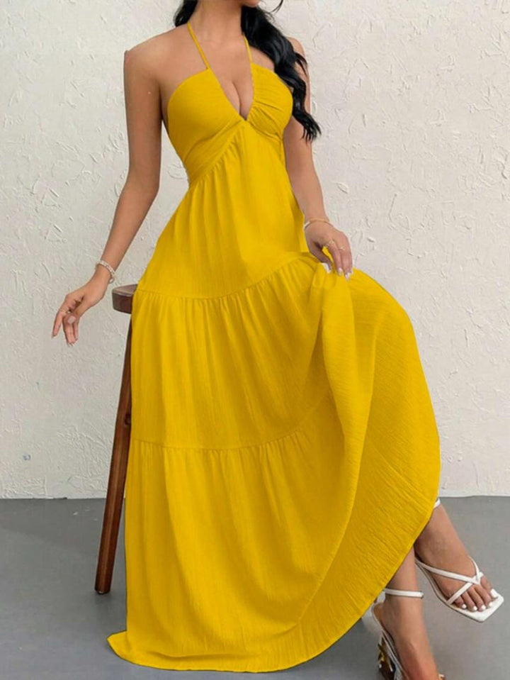 Sophisticated women's halter maxi dress, ideal for weddings or evening wear, showcasing an elegant design.
