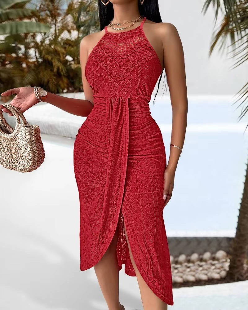 Chic halter neck maxi dress with a slit and hollow detailing, versatile for elegant parties or vacation evenings.
