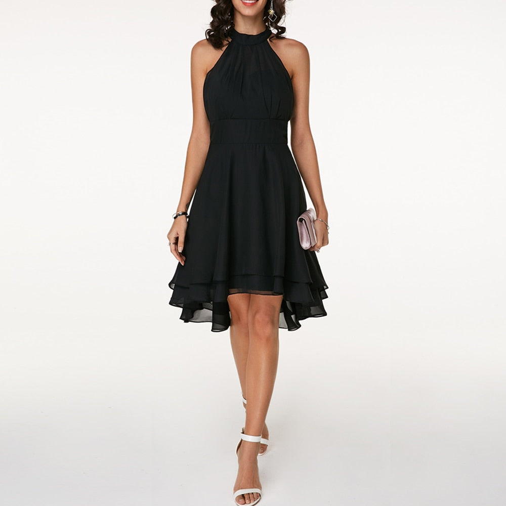 Chic women's halter neck mini dress with a tiered, flowing layered hem. Stylish fit & flare design.
