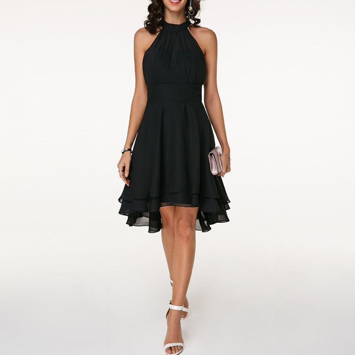 Chic women's halter neck mini dress with a tiered, flowing layered hem. Stylish fit & flare design.