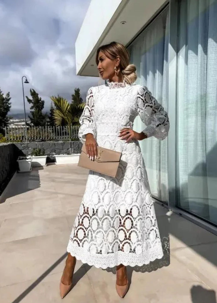 Modest women's maxi dress featuring an elegant high-neck and sophisticated puff long sleeves.