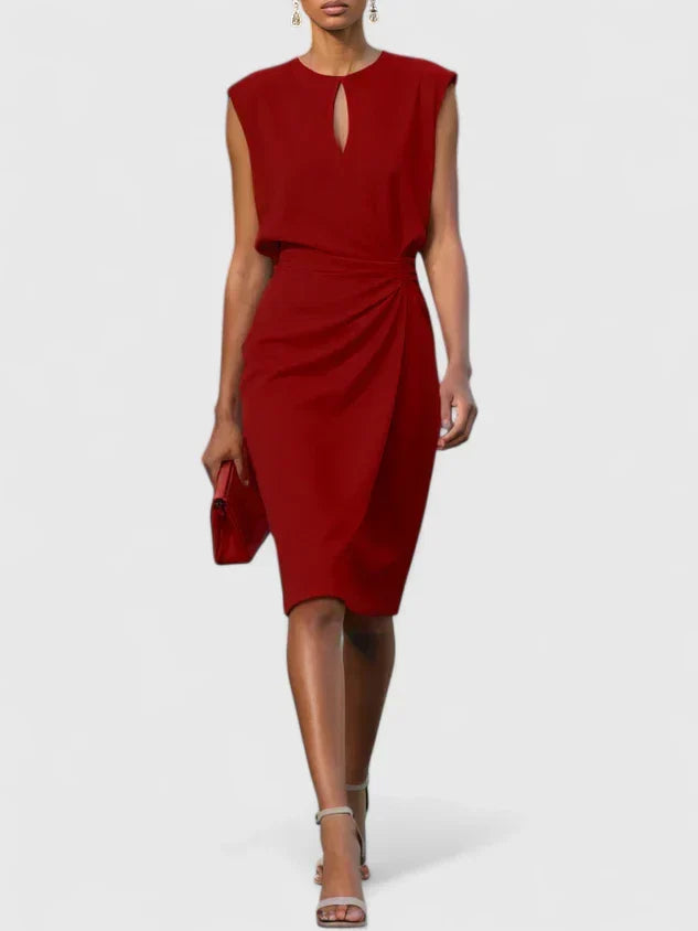 Elegant women's midi dress, perfect for wedding guests, features a stylish keyhole & ruched waist.