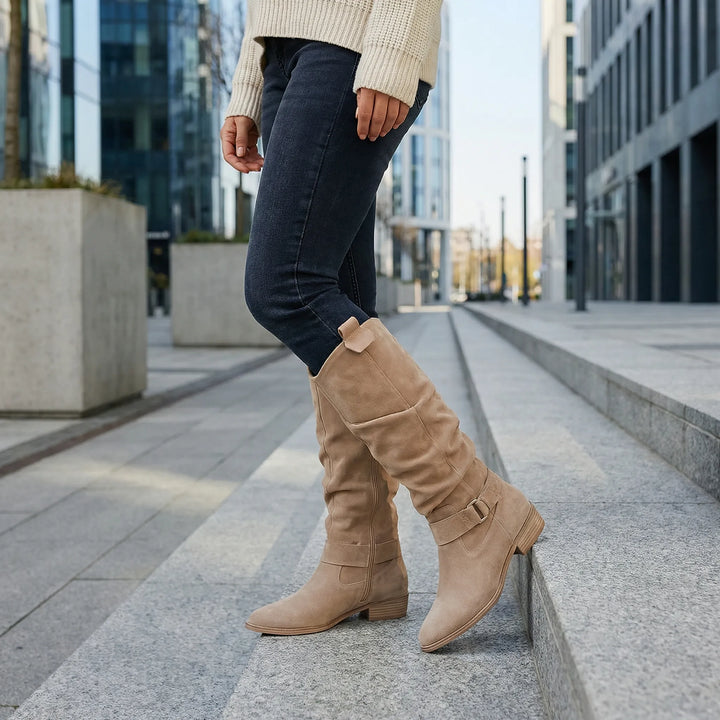 Elegant women's knee-high boots. Comfortable stylish footwear with a block heel & side zipper for autumn fashion.