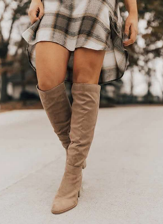 Stylish women's knee-high boots with a sturdy block heel, offering elegant comfort for fall footwear.