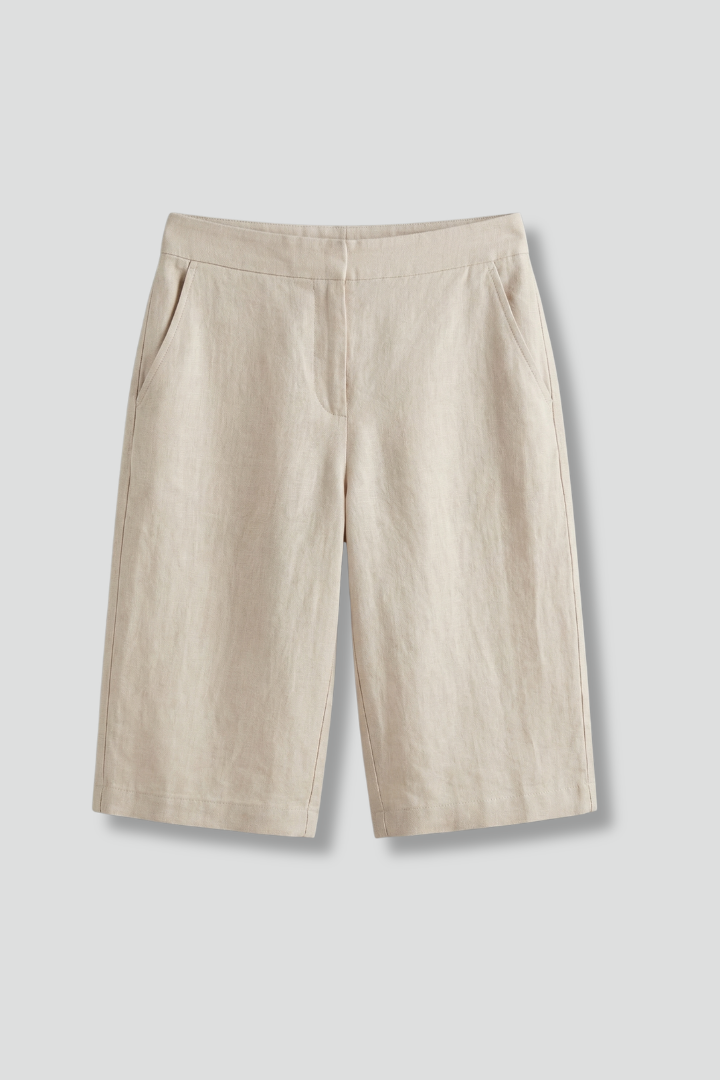 Elegant women's knee-length tailored shorts with a flat front, perfect for smart casual summer fashion.