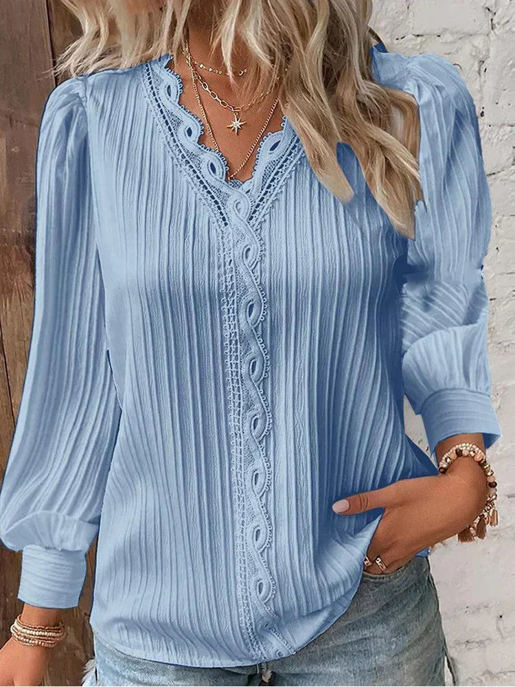 Versatile women's lace top with puff sleeves, ideal for elegant summer or spring everyday wear.