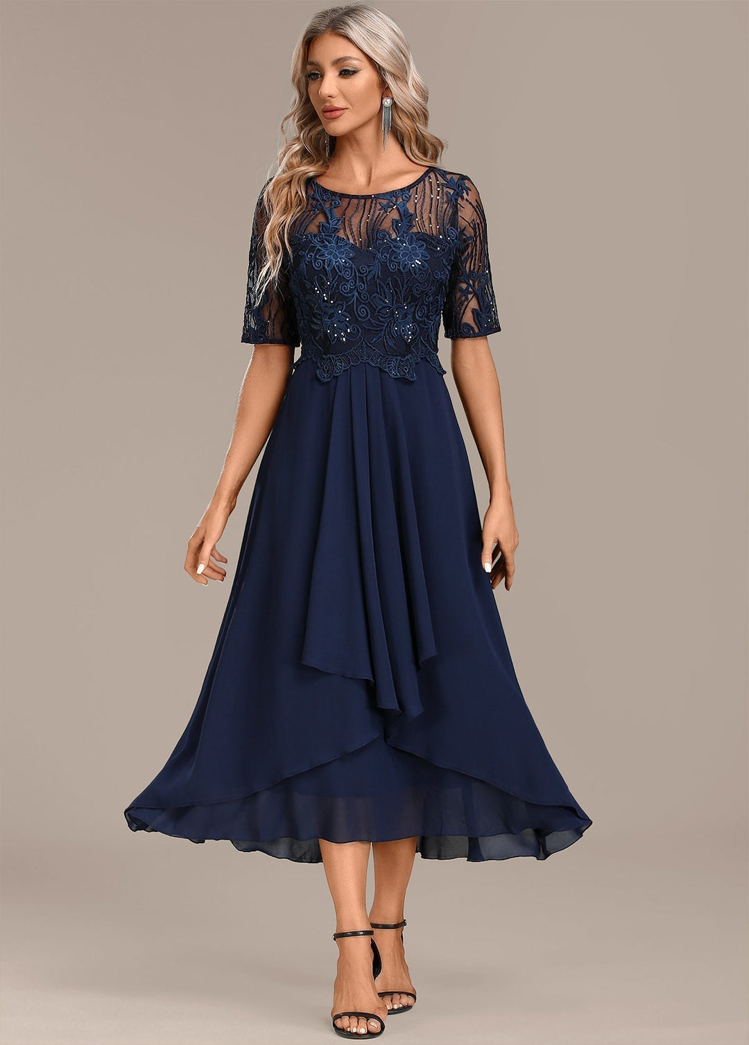 Elegant women's lace midi dress with short sleeves, perfect for occasion wear. Flattering and sophisticated.