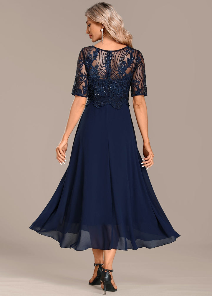 Chic women's short sleeve lace midi dress, featuring elegant lace detail and midi length for occasion wear.