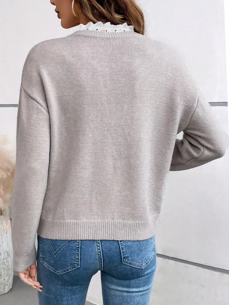 Stylish women's lace-trim V-neck sweater, great for a comfortable, sophisticated workwear outfit.