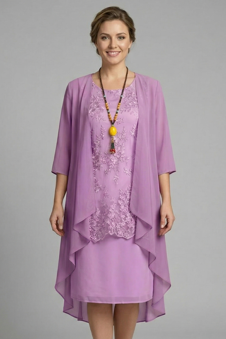 Elegant women's sheer overlay dress with a layered design, round neck, short sleeves, and a flattering flared knee-length cut.