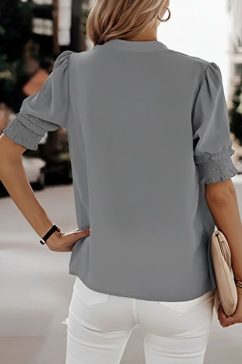Soft, lightweight women's V-neck blouse with stylish puff sleeves, offering a comfortable and elegant casual look.