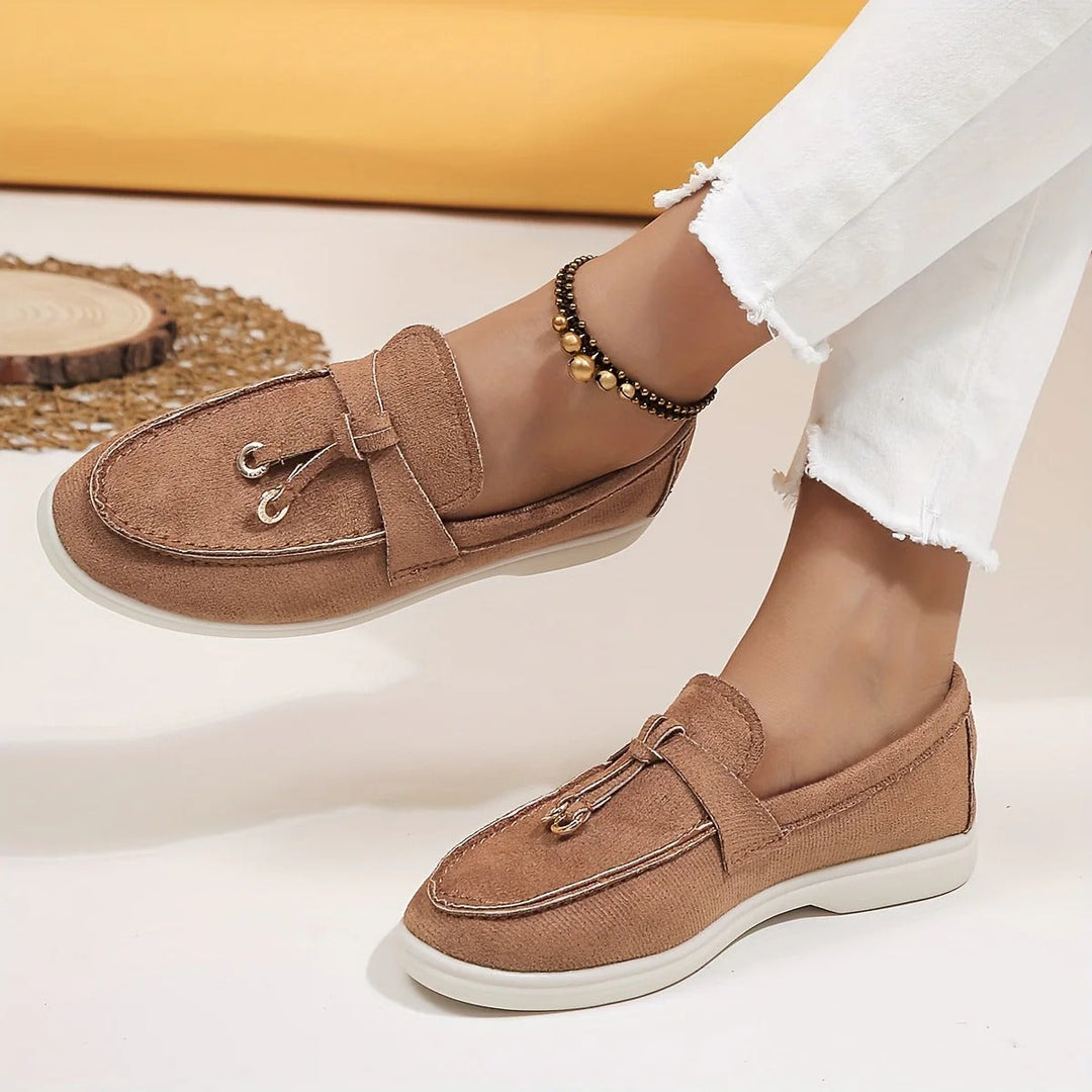 Elegant women's loafers with chic tassel detail. Perfect slip-on flats for sophisticated everyday style.