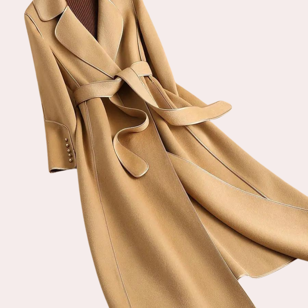 Tailored women's long coat, double-breasted with a chic belted waist. Elegant and versatile for fall fashion.
