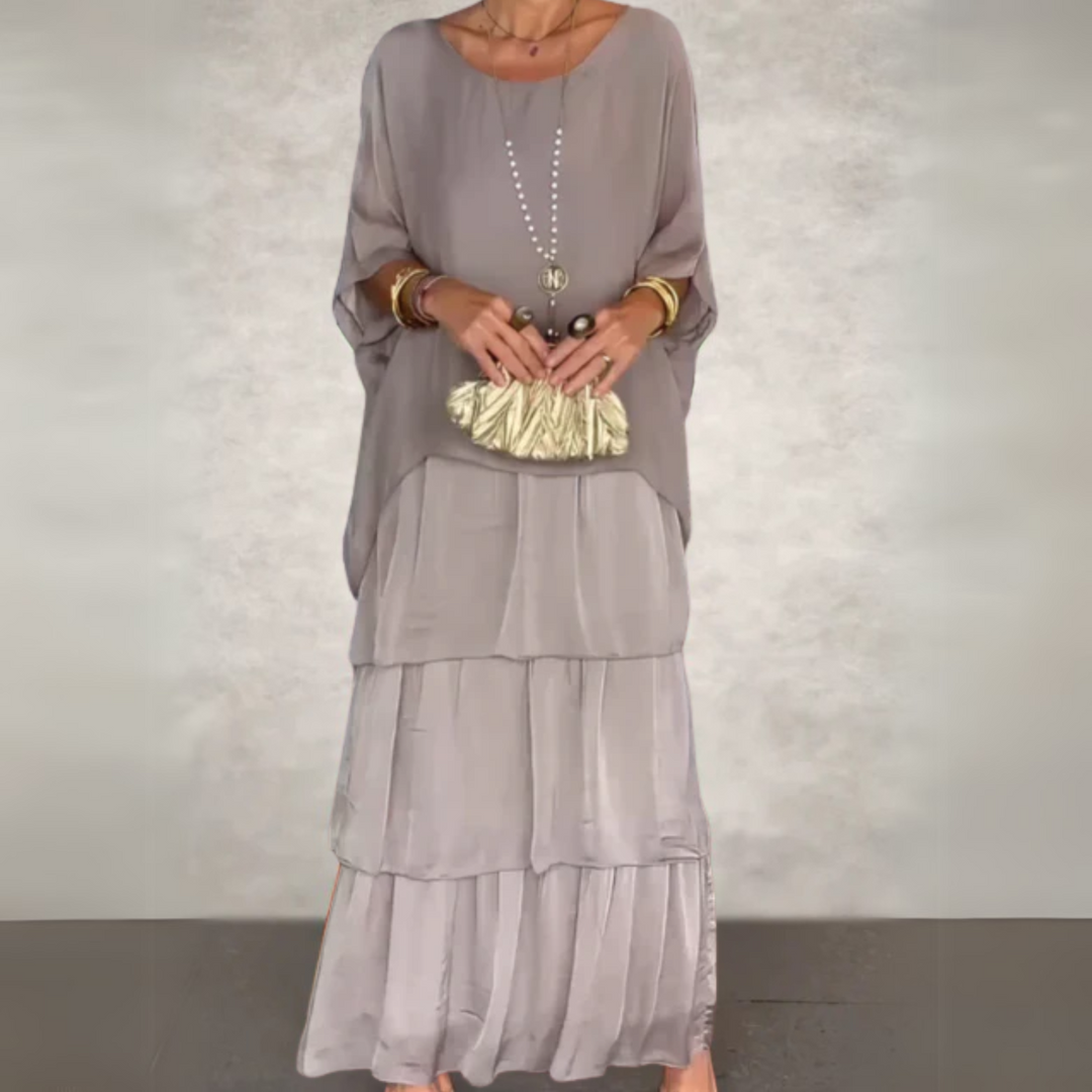 Back view of a versatile women's elegant long maxi dress, ideal for summer occasion wear.