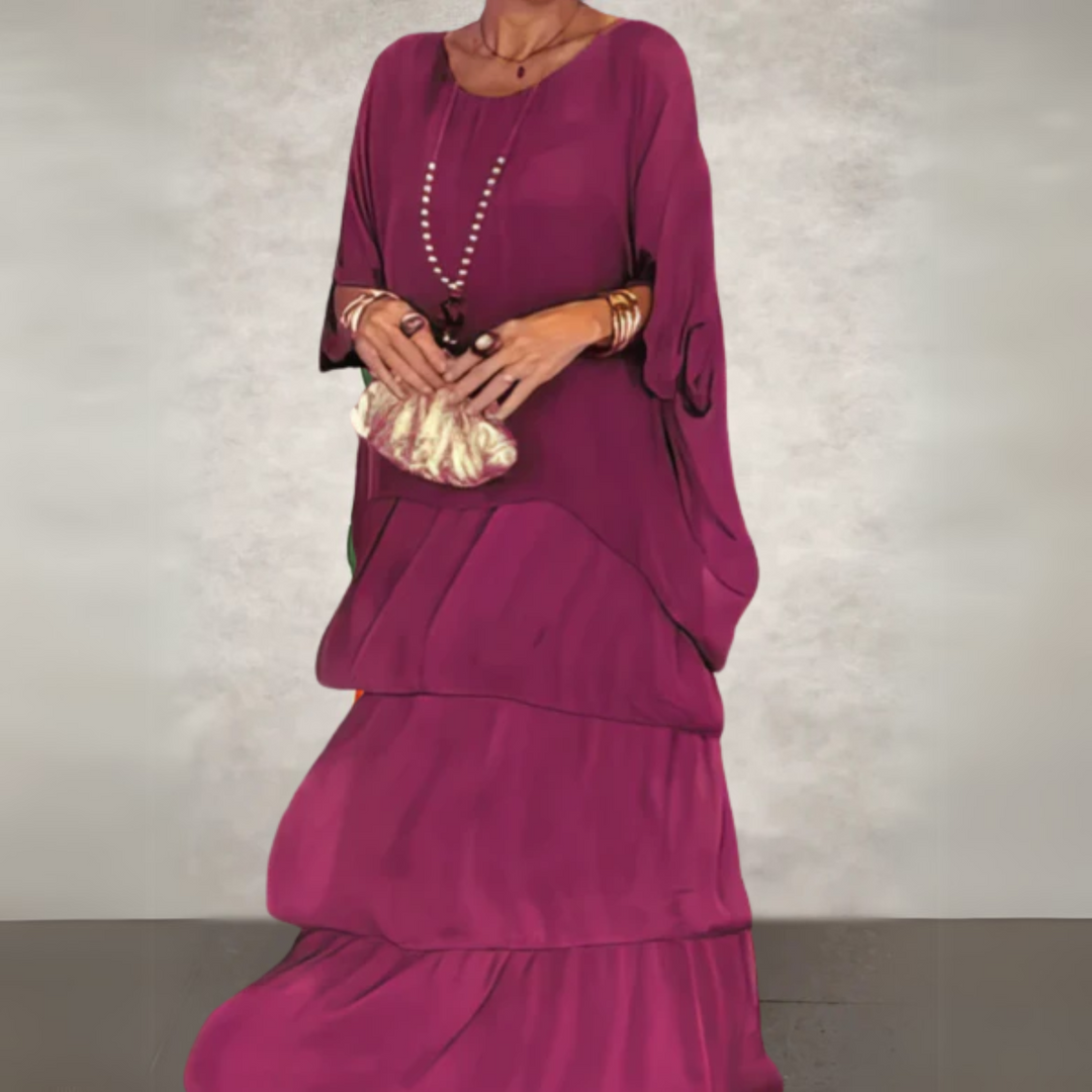 Side view of a fashionable women's flowing maxi dress, emphasizing its graceful drape and long design.