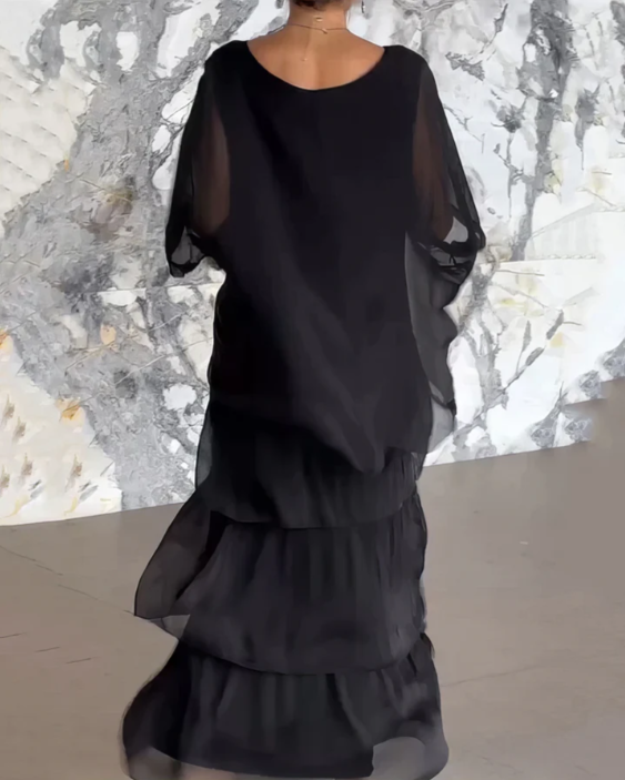 Women's flowing maxi dress in motion, showcasing its elegant drape, comfortable design, and versatility.