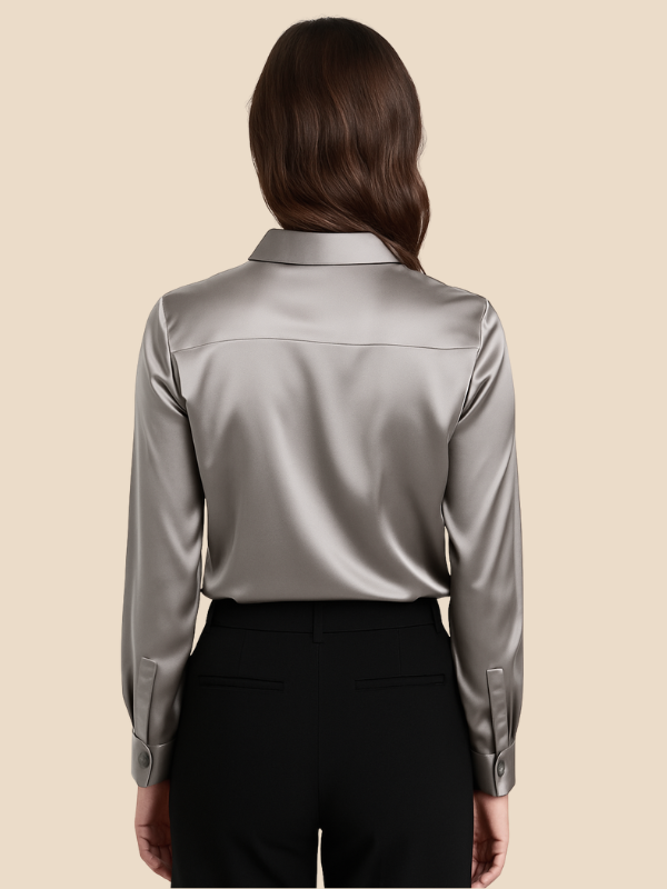 Close-up of buttons on a professional women's long sleeve button blouse.