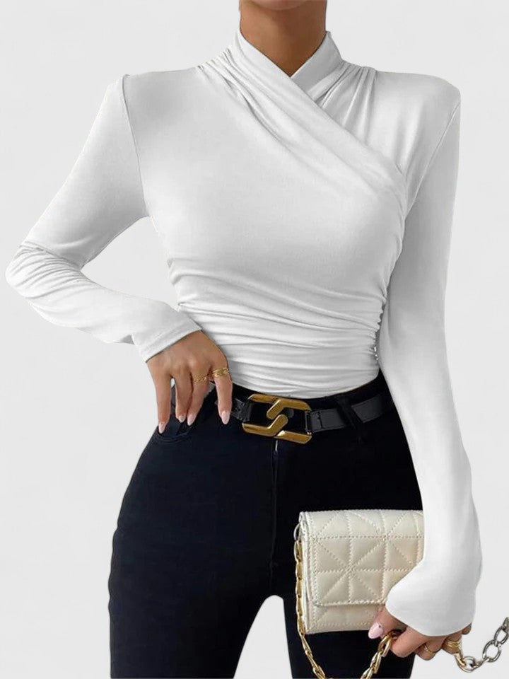 Fashionable women's long sleeve top with an elegant criss-cross design. A stylish and versatile choice for fall and winter.