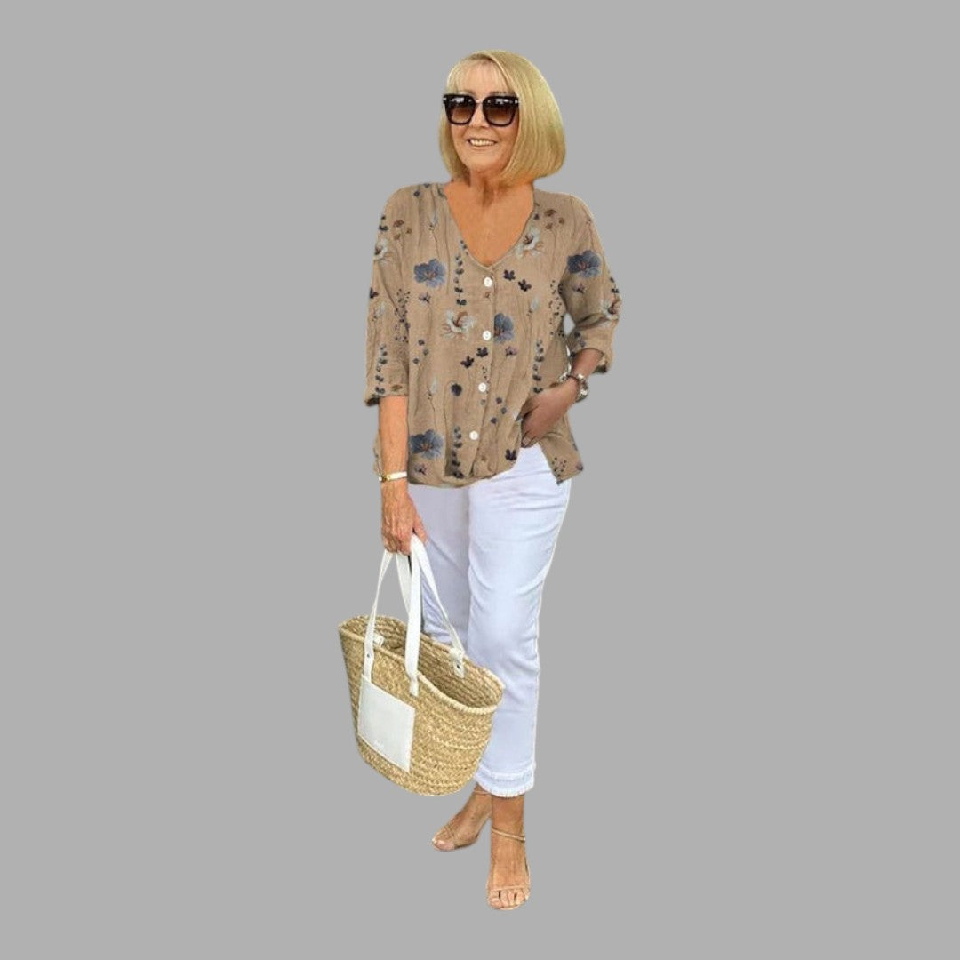 Stylish women's floral print blouse, comfortable and versatile for everyday chic or ladies office wear.