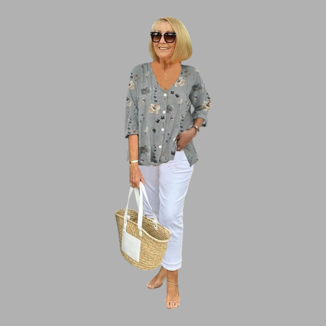 Graceful women's semi-formal floral blouse with long sleeves, ideal for office and stylish occasions.