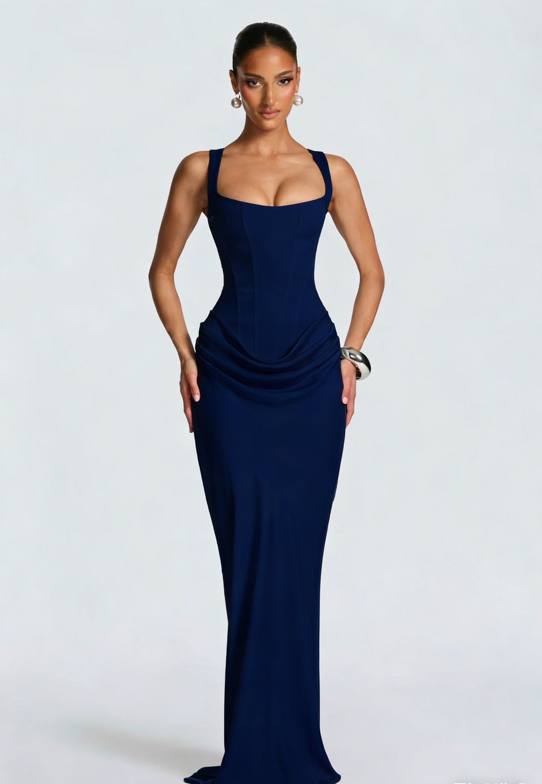 Women's elegant maxi dress with a corset bodice and wide straps, ideal for formal evening occasions.
