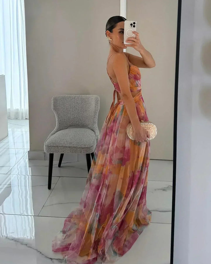 Women's flowy layered maxi dress, an elegant sleeveless choice for summer vacations and beach occasions.