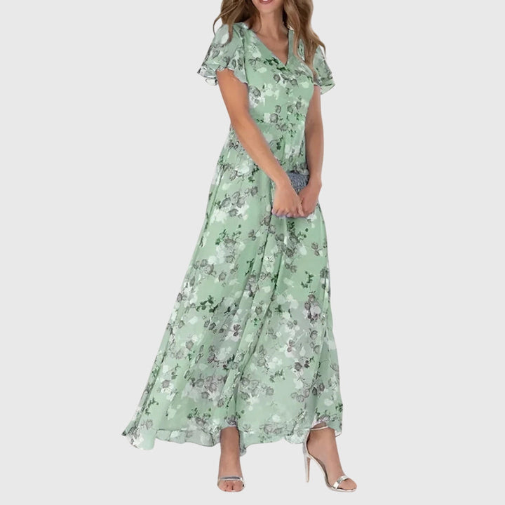 V-neck A-line maxi dress for women featuring delicate flutter sleeves and a stylish all-over print.