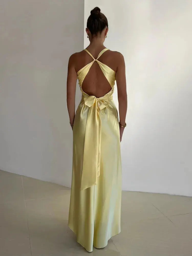 Elegant women's maxi dress with halter neck and open back, perfect for special occasions.