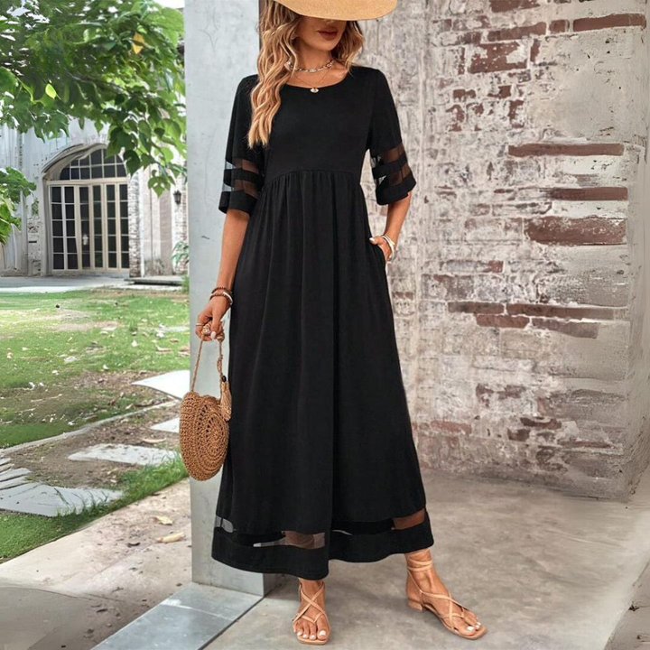 Elegant women's mesh panel maxi dress with a flattering gathered waist, ideal for evening or spring occasions.
