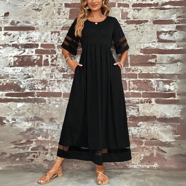 Graceful long women's maxi dress featuring sophisticated mesh panels and a stylish, cinched gathered waist.