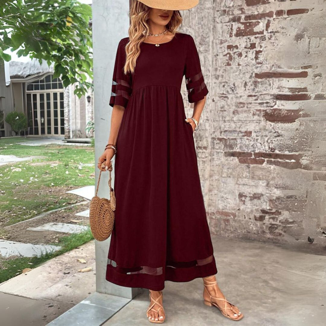Stylish women's long dress; a modern maxi with see-through mesh panels and a comfortable, gathered waist design.