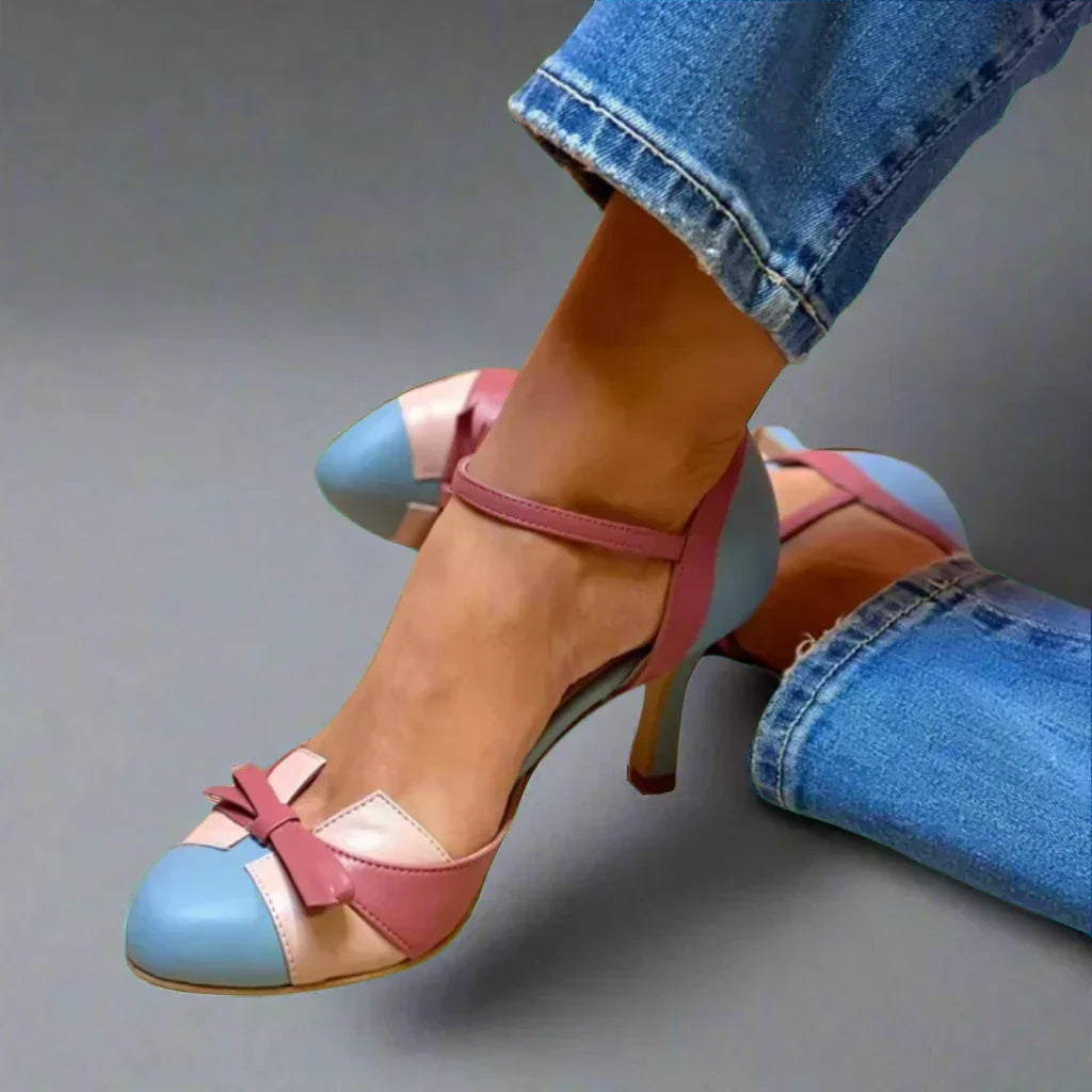 Elegant women's mid heel pumps with charming bow strap. Perfect classic dress shoes for occasion wear & summer comfort.