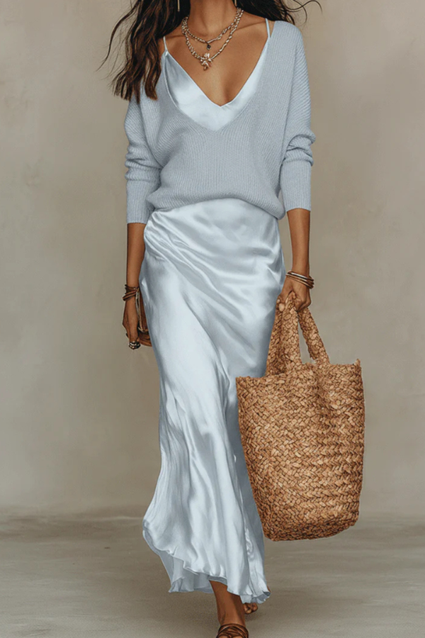 Elegant women's midi dress paired with a soft sweater. A coordinated two-piece set for sophisticated style.