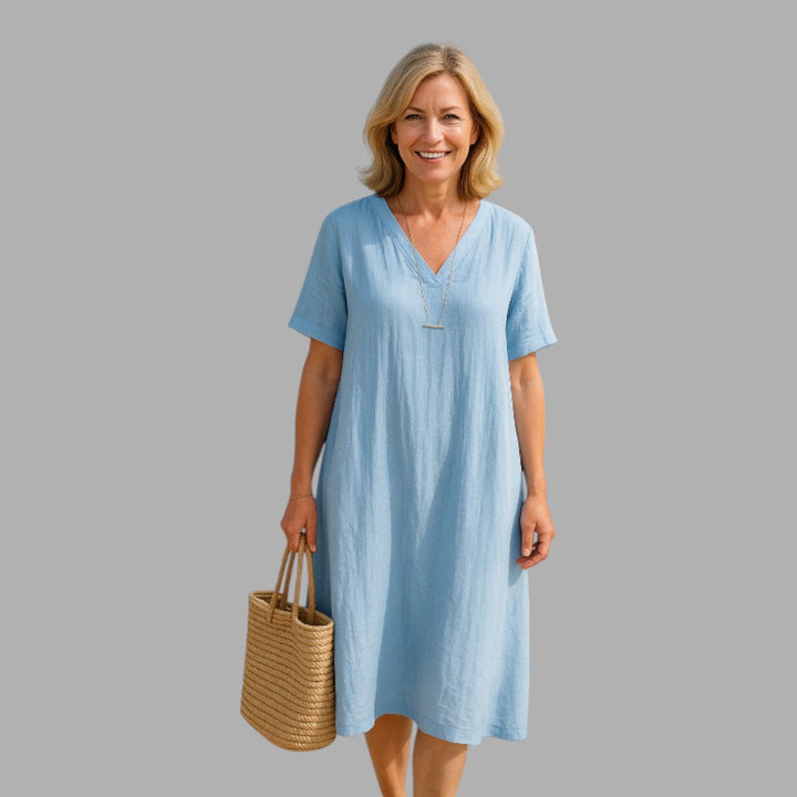 Elegant women's midi dress, refined style & comfortable fit for semi-formal occasions.