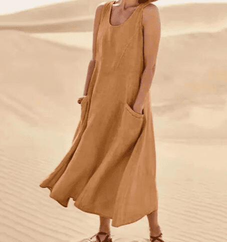 Model wearing an elegant women's midi dress with pockets, showcasing comfortable everyday spring/summer style.