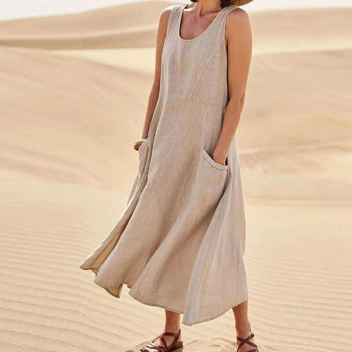 Comfortable sleeveless midi dress for women, ideal for elegant spring fashion & everyday wear with pockets.