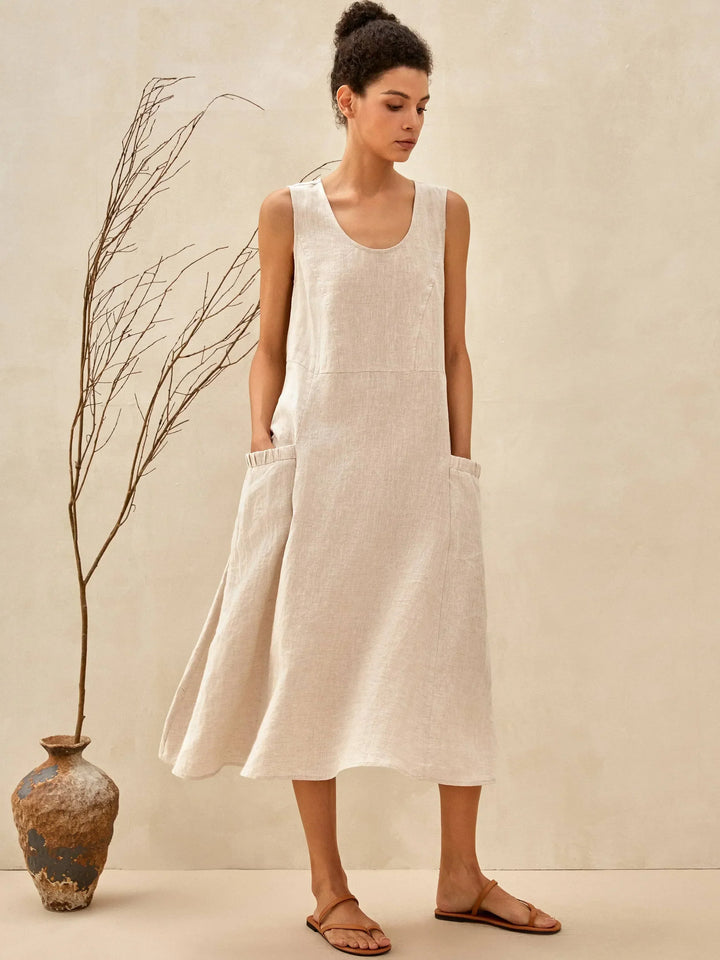 Sleeveless women's midi dress with pockets, offering elegant everyday style & comfort for spring/summer.