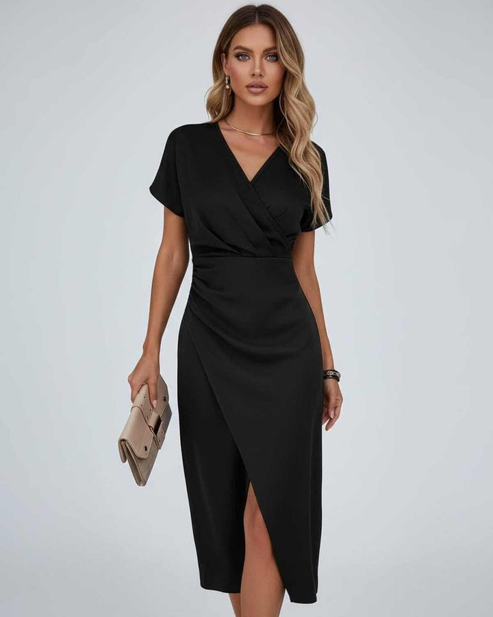 Comfortable & stylish women's midi wrap dress. Features a flattering V-neck, short sleeves, and trendy split hem.
