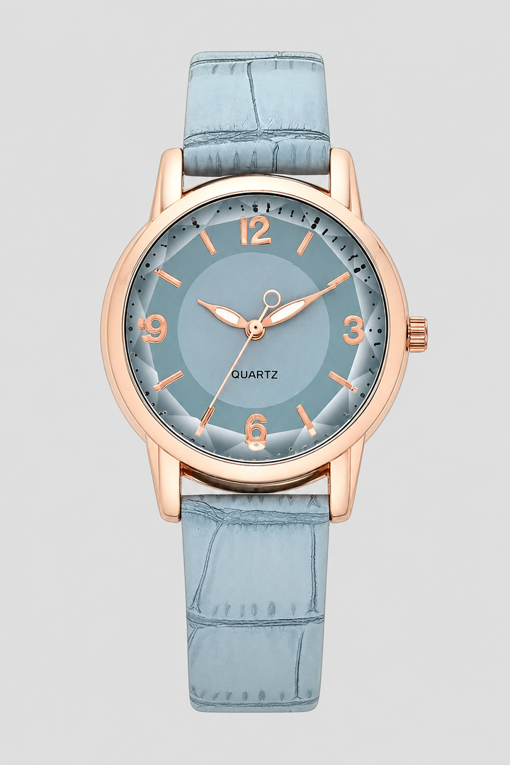 Chic women's dress watch with a minimalist aesthetic and a distinctive embossed strap, enhancing any outfit.