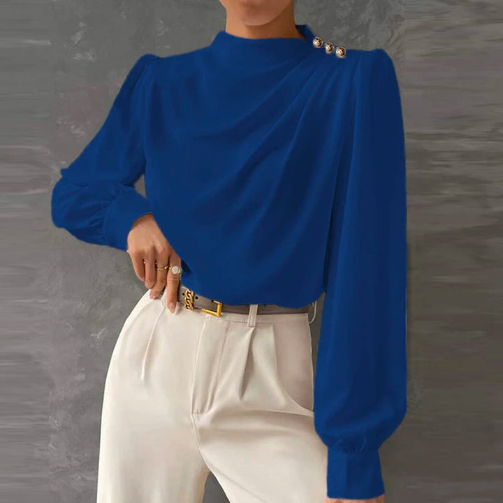 Stylish women's long sleeve mock neck blouse with delicate ruching and eye-catching gold button accents, a statement top.