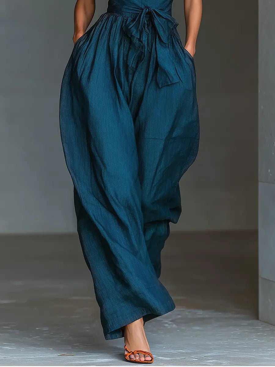Comfortable & fashionable navy blue wide leg halter jumpsuit, a versatile sleeveless outfit for vacation or parties.