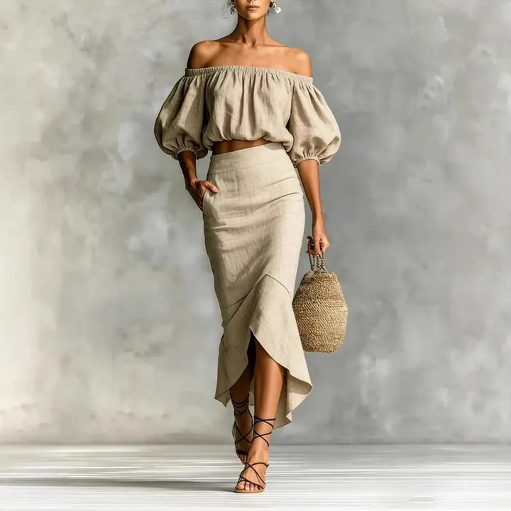 Elegant women's off-shoulder puff sleeve crop top & matching midi wrap skirt set. Perfect for summer brunch.