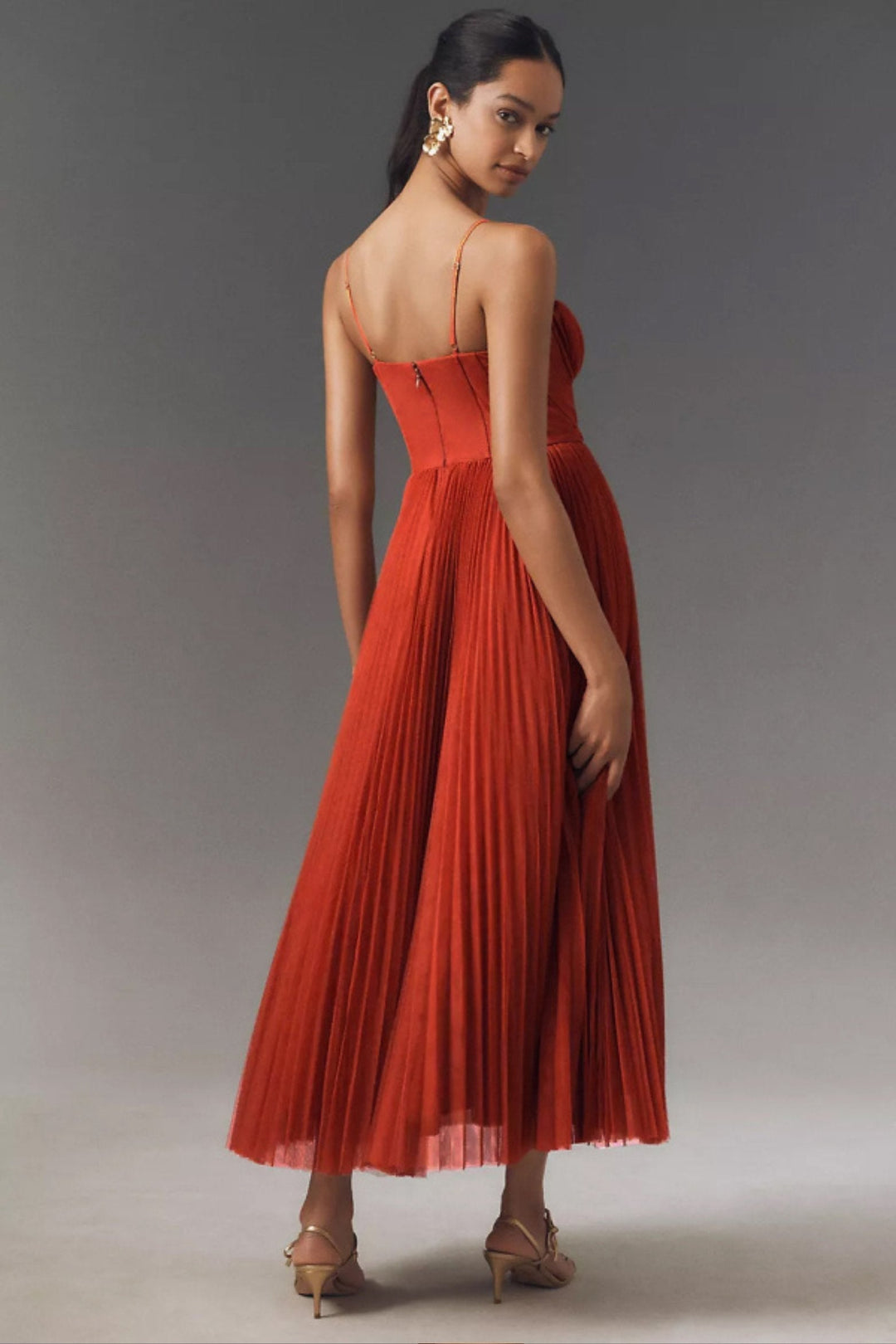 Women's elegant one-shoulder flowy midi formal dress, featuring delicate pleated tulle, for wedding guests.