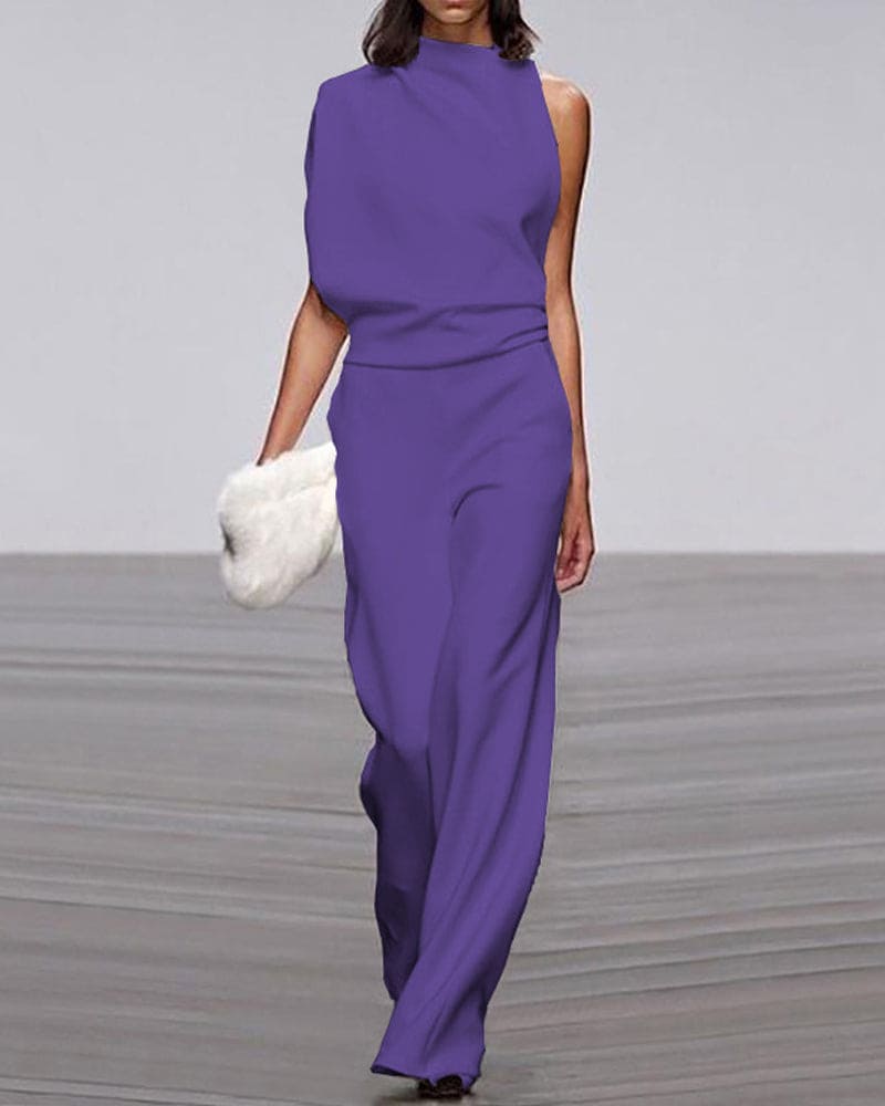 A woman models an elegant one-shoulder wide-leg evening jumpsuit, perfect for a sophisticated party look.